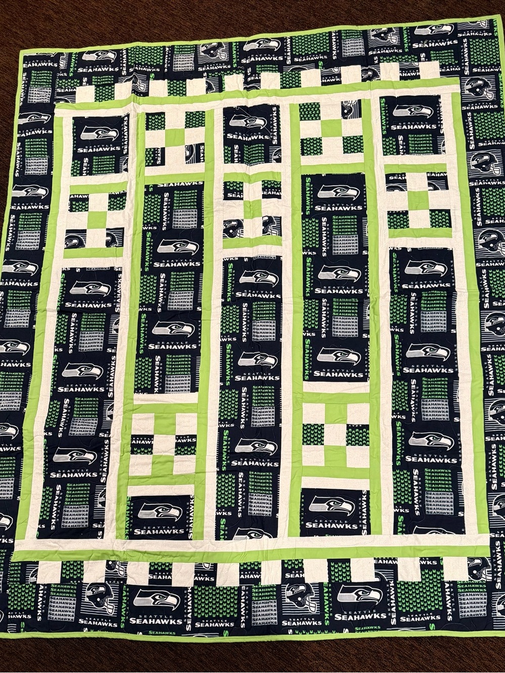 A beautifully crafted, one‑of‑a‑kind handmade throw featuring four detailed trai